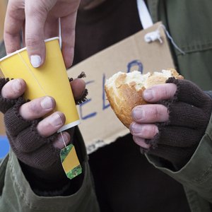 A man receives food from a shelter.